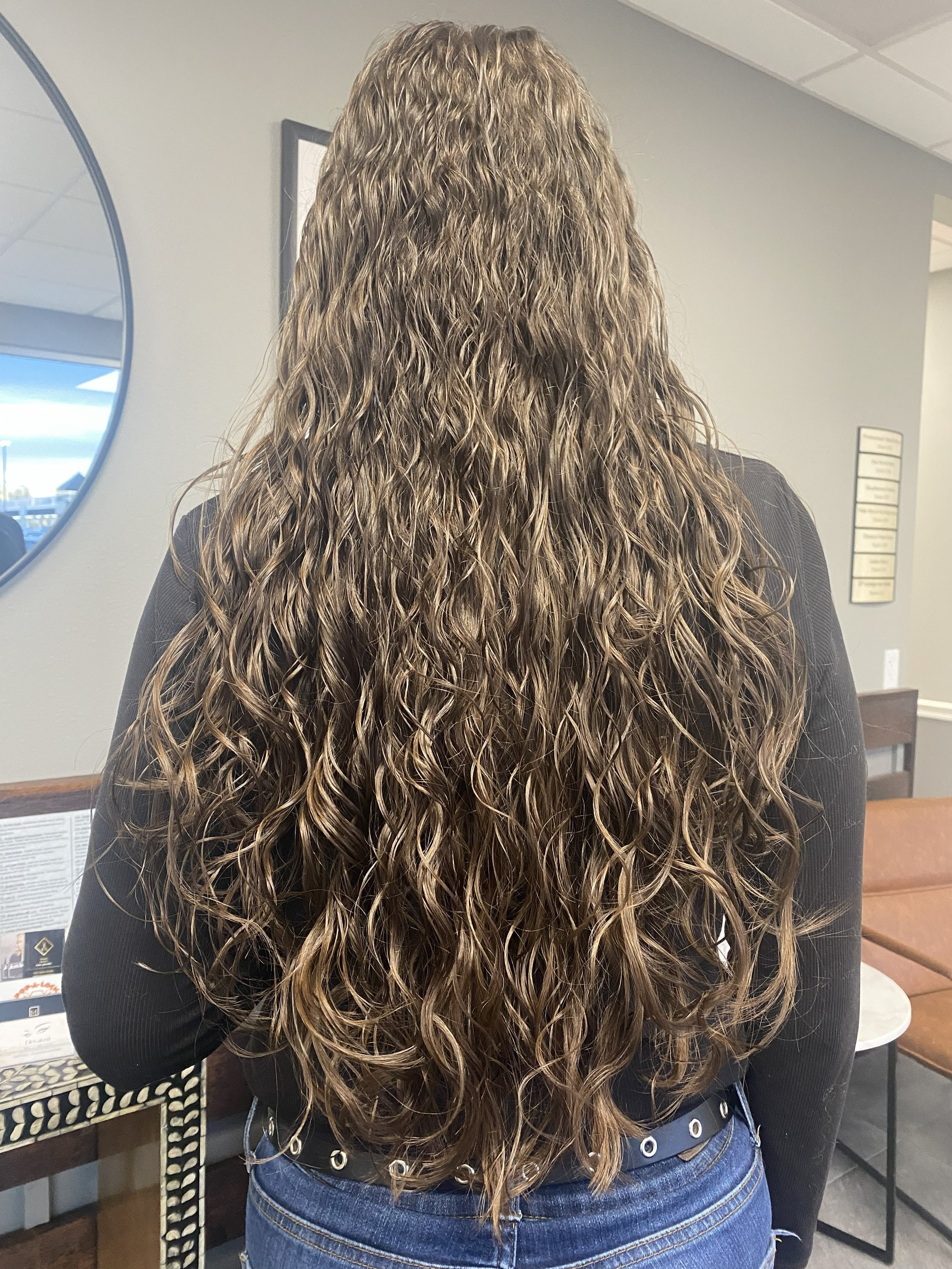 Haircut and teaching clients how to enhance their natural curls.jpg