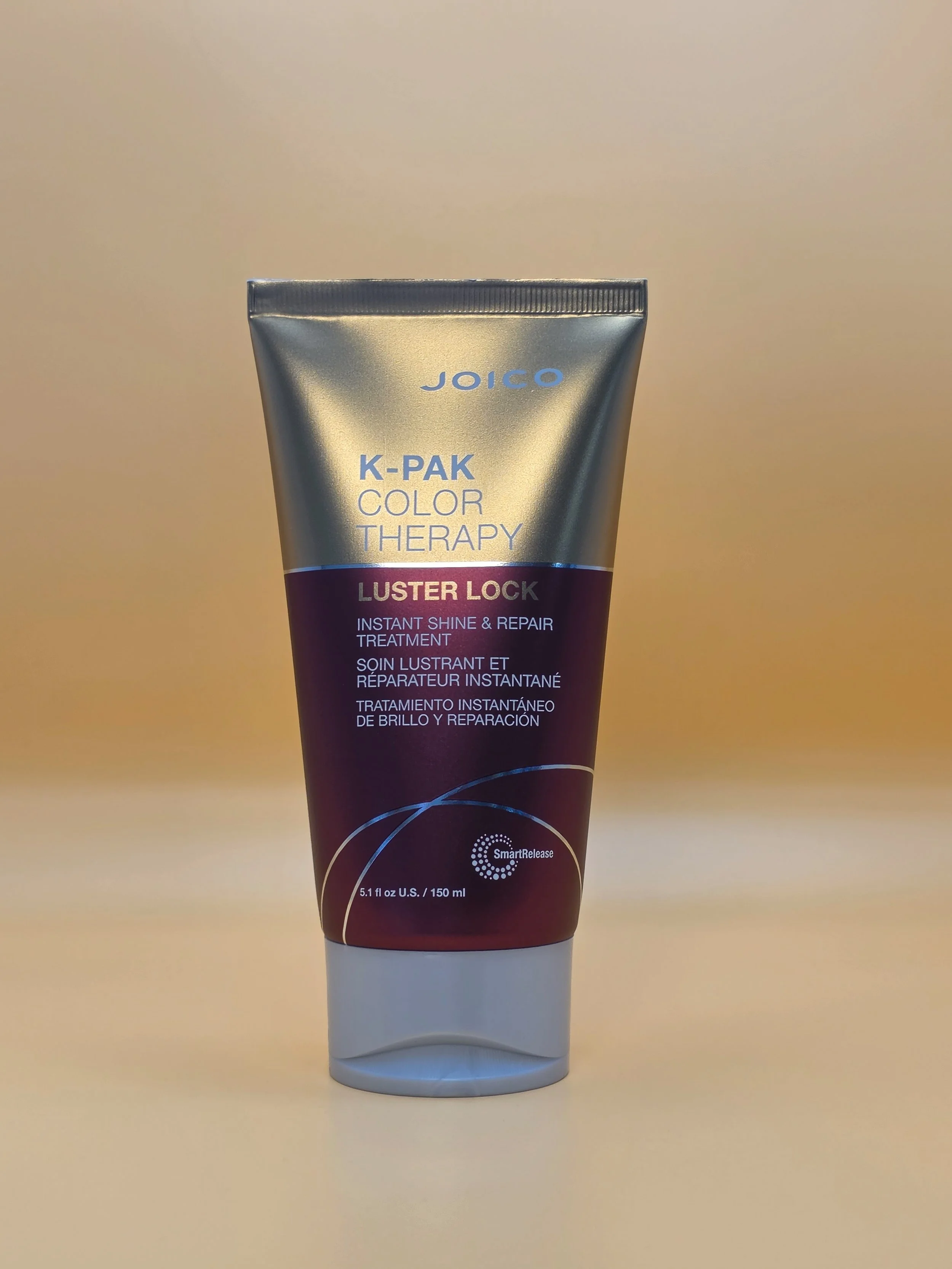 A tube of Joico K-Pak Color Therapy Luster Lock treatment, standing upright against a plain background.