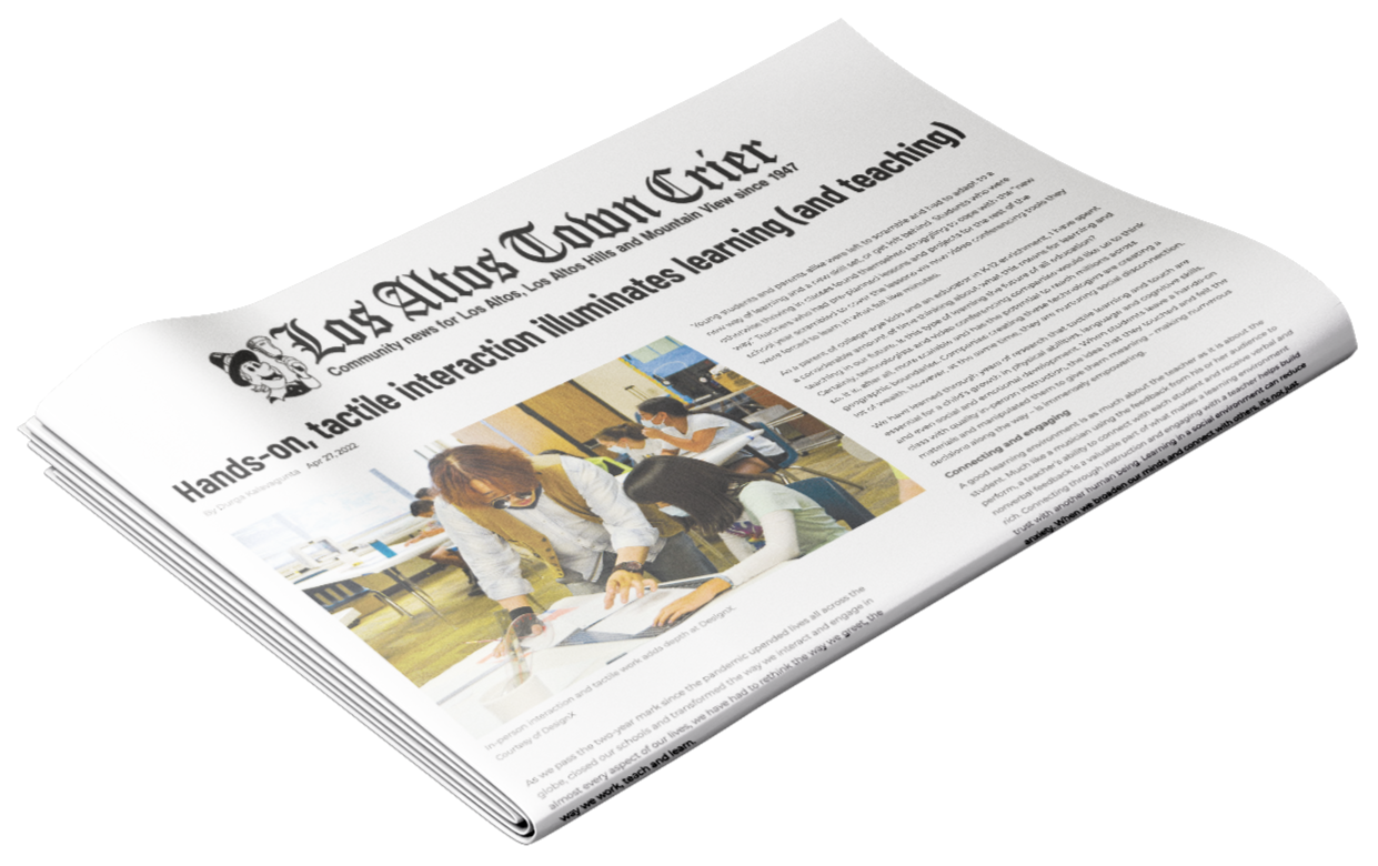 A community newspaper titled 'Los Altos Altos Chronicle' with a headline about hands-on, tactile interaction in education, featuring a photo of a teacher assisting two students with a project in a classroom.