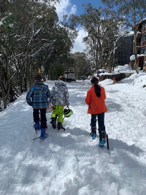 Kids walking in snow village.jpg