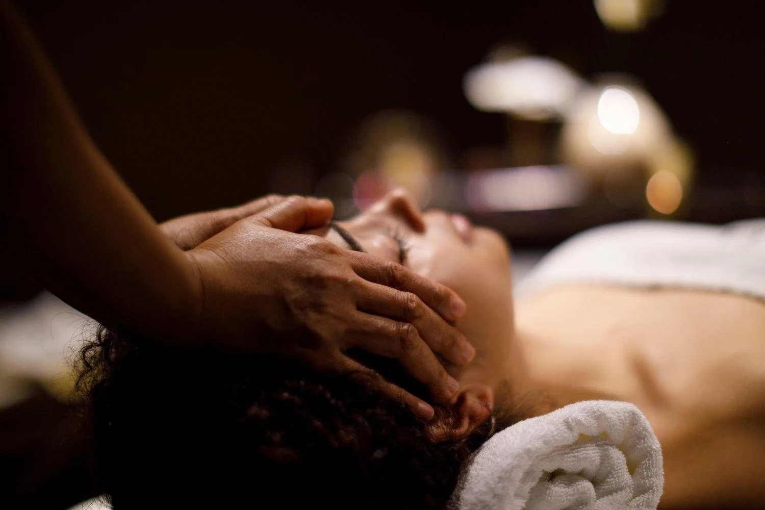 RMT hands on clients forehead and scalp