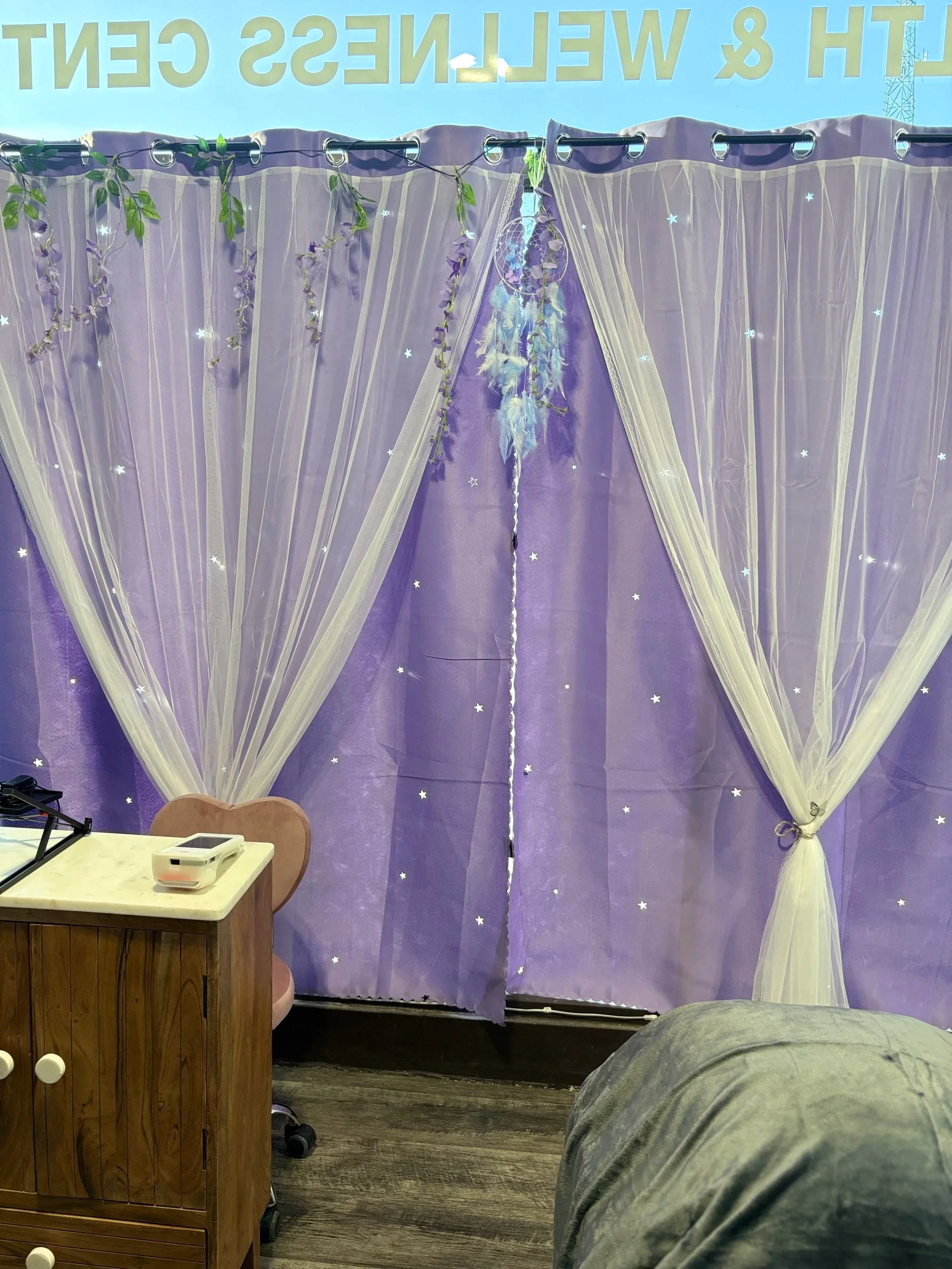 purple curtains, part of desk, chair and table