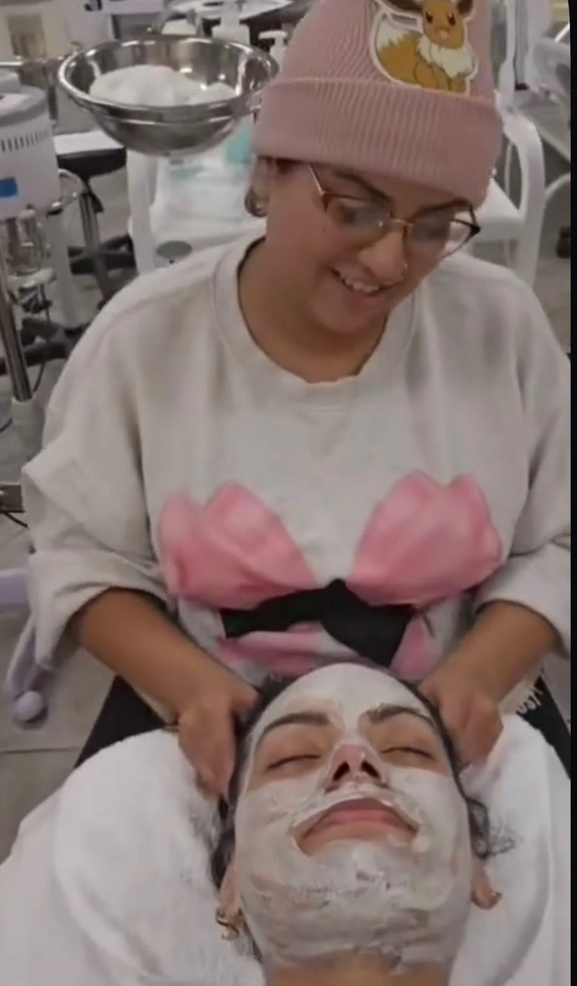 Picture of Monique thaker and client getting a facial and head rub, Instagram post