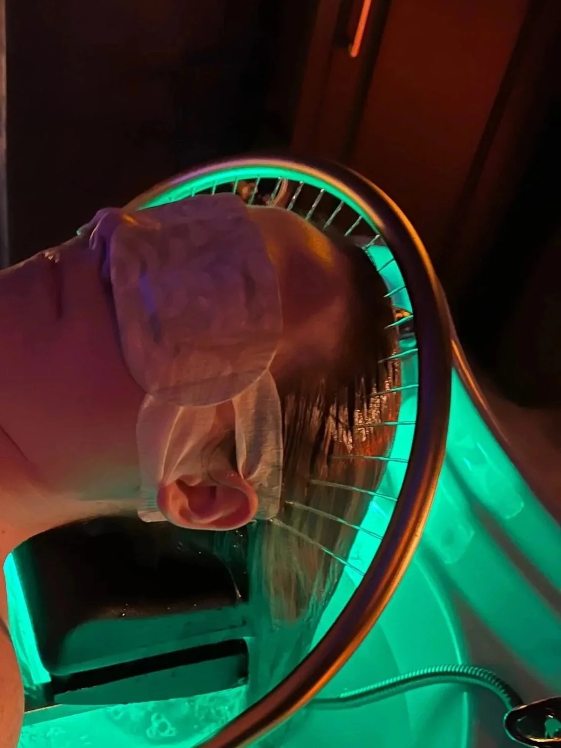 head spa treatment with water and halo light over the head/hair