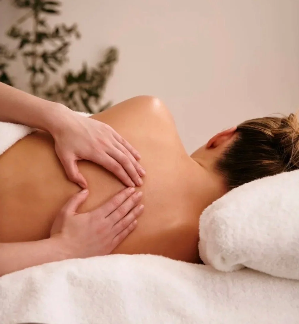 RMT hands on pregnant clients back while they're  sideline