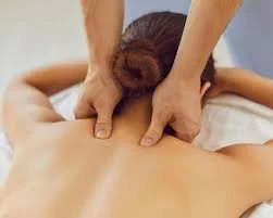 client face down with RMT hands on the back of their neck