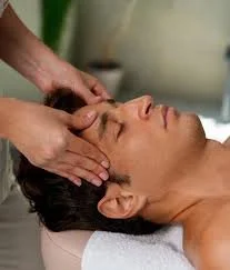 craniosacral technique on clients's forehead