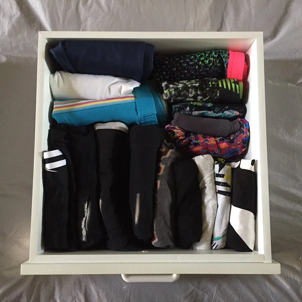 Birds eye view of a drawer full of neatly folded active wear