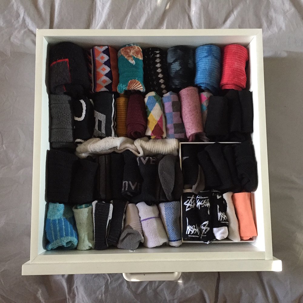 Birds eye view of a sock drawer with neatly folded socks