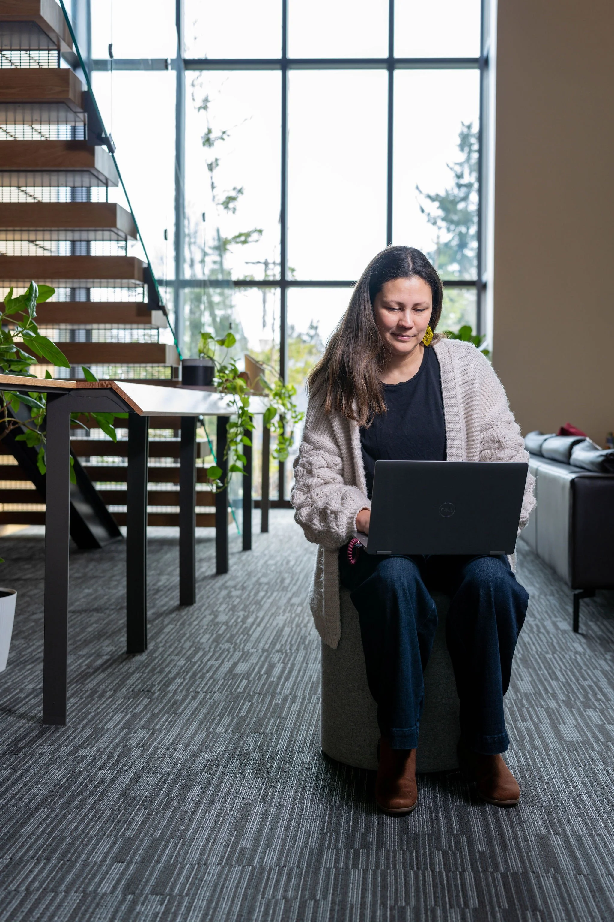 Photo of Hannah working on her laptop.