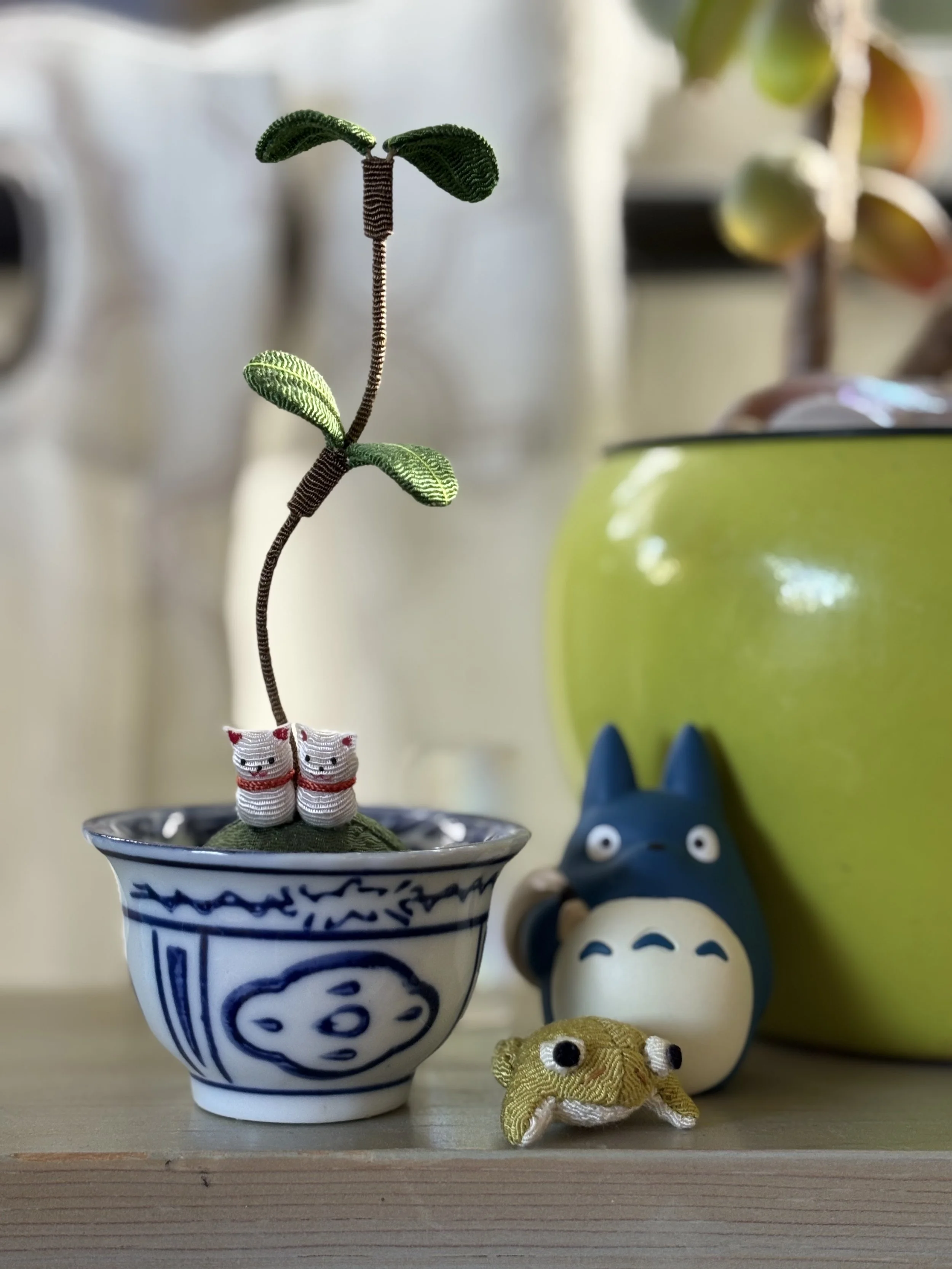 Photo of cute toys from Japan including cats, a frog, and a Totoro figure.