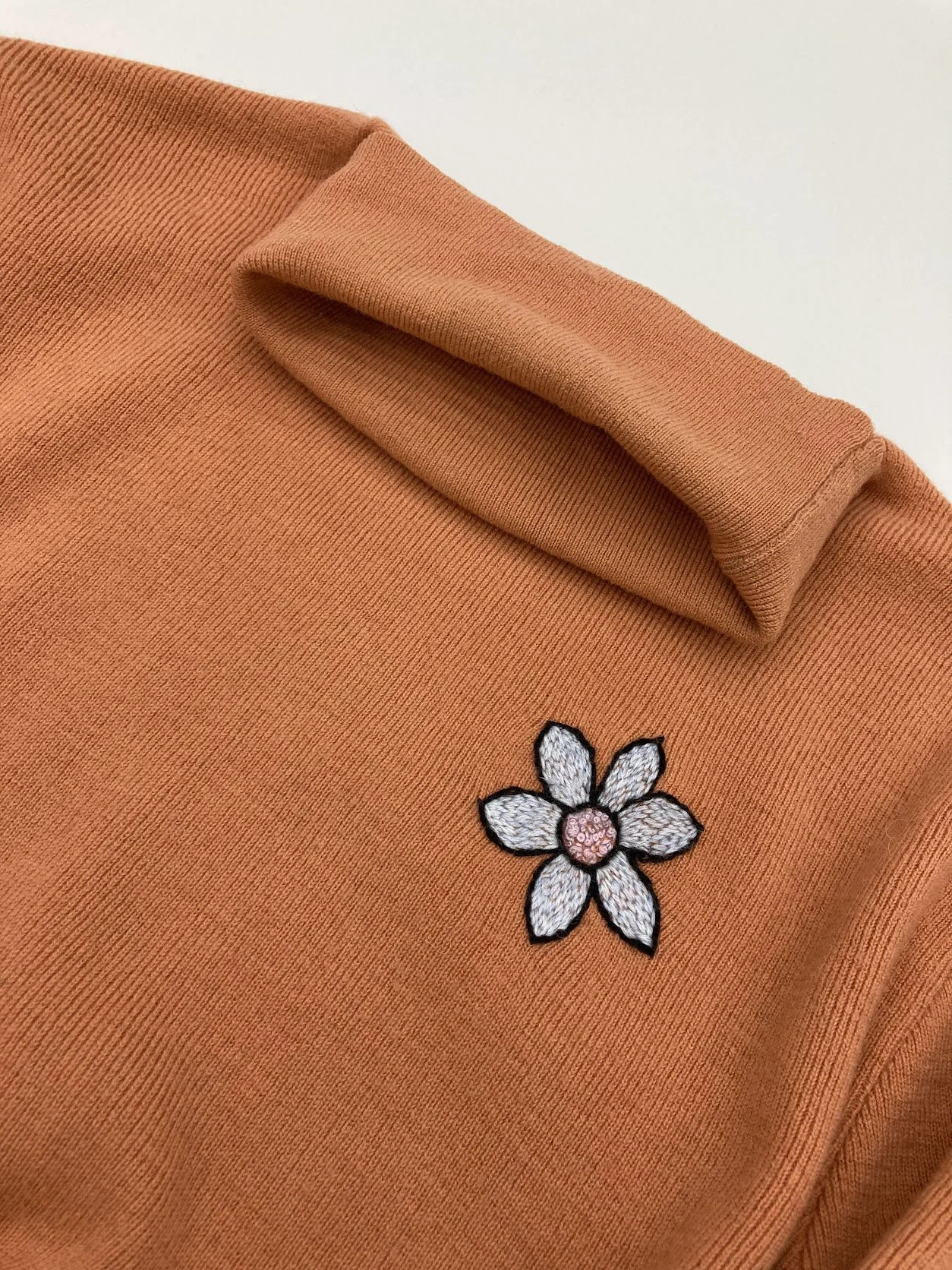 wafa remix knitwear visible mend repair art creative craft orange flower embroidery