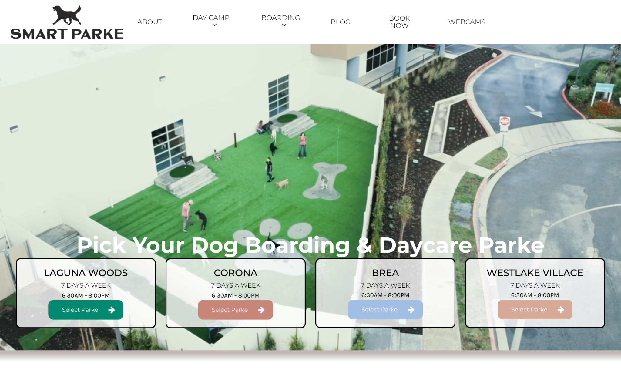 Smart Parke website featuring its dog boarding and daycare locations and an aerial view of the outdoor play area.