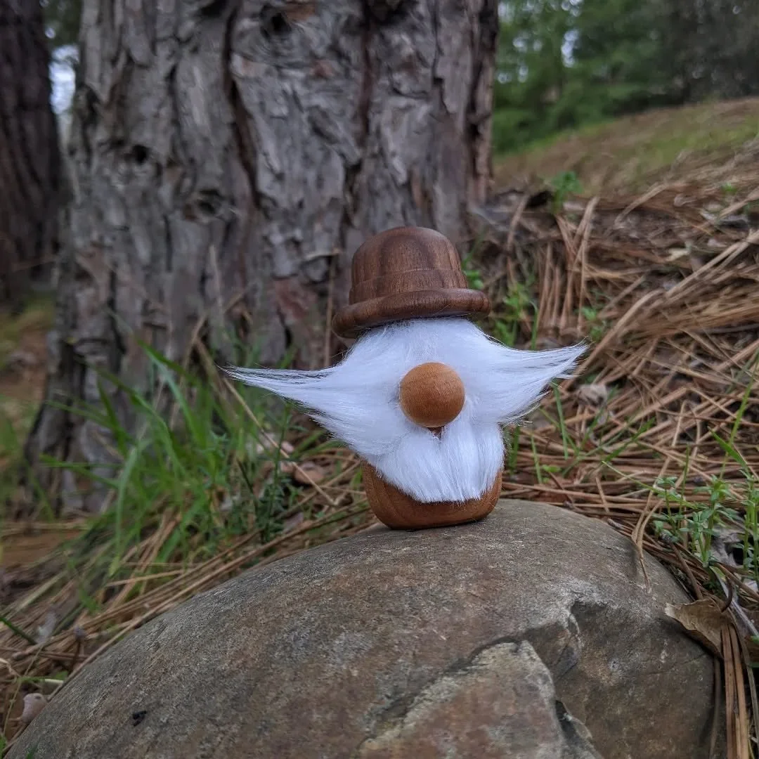 Tried something new with my first wood gonk 🌲Turned from oak, walnut, &amp; cherry

#woodturning #woodart #woodengnome #handmade #gonk