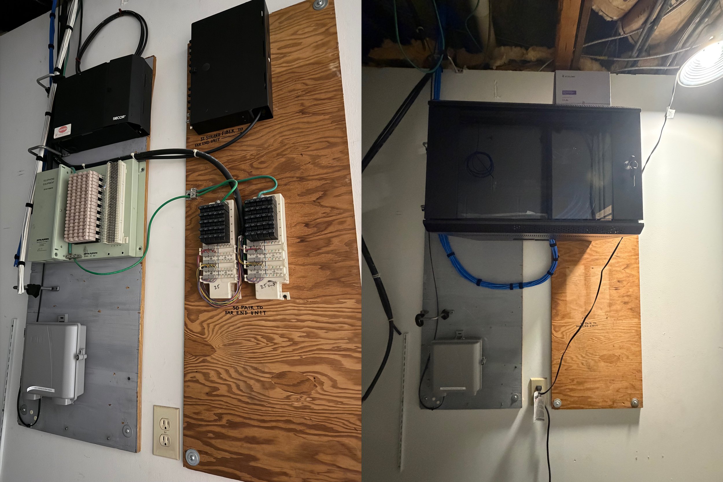 Electrical control panels and wiring installed on a wall, with some components mounted on wooden boards, including a black metal enclosure, a gray box, and electrical wires.