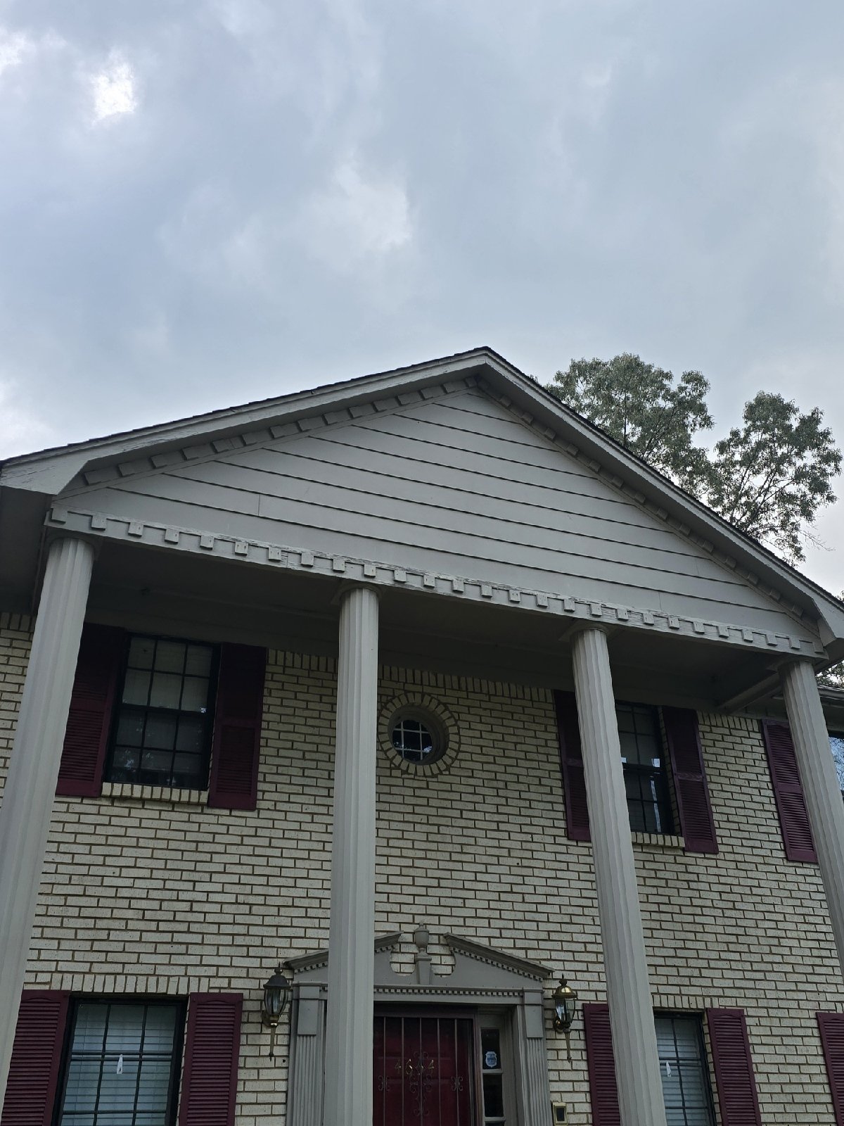 This homeowner reached out looking to refresh the exterior of their home. Over time, the siding, shutters, and windows had begun to show wear, the fence was damaged, and the existing deck no longer met their needs. They wanted an updated, cohesive ex