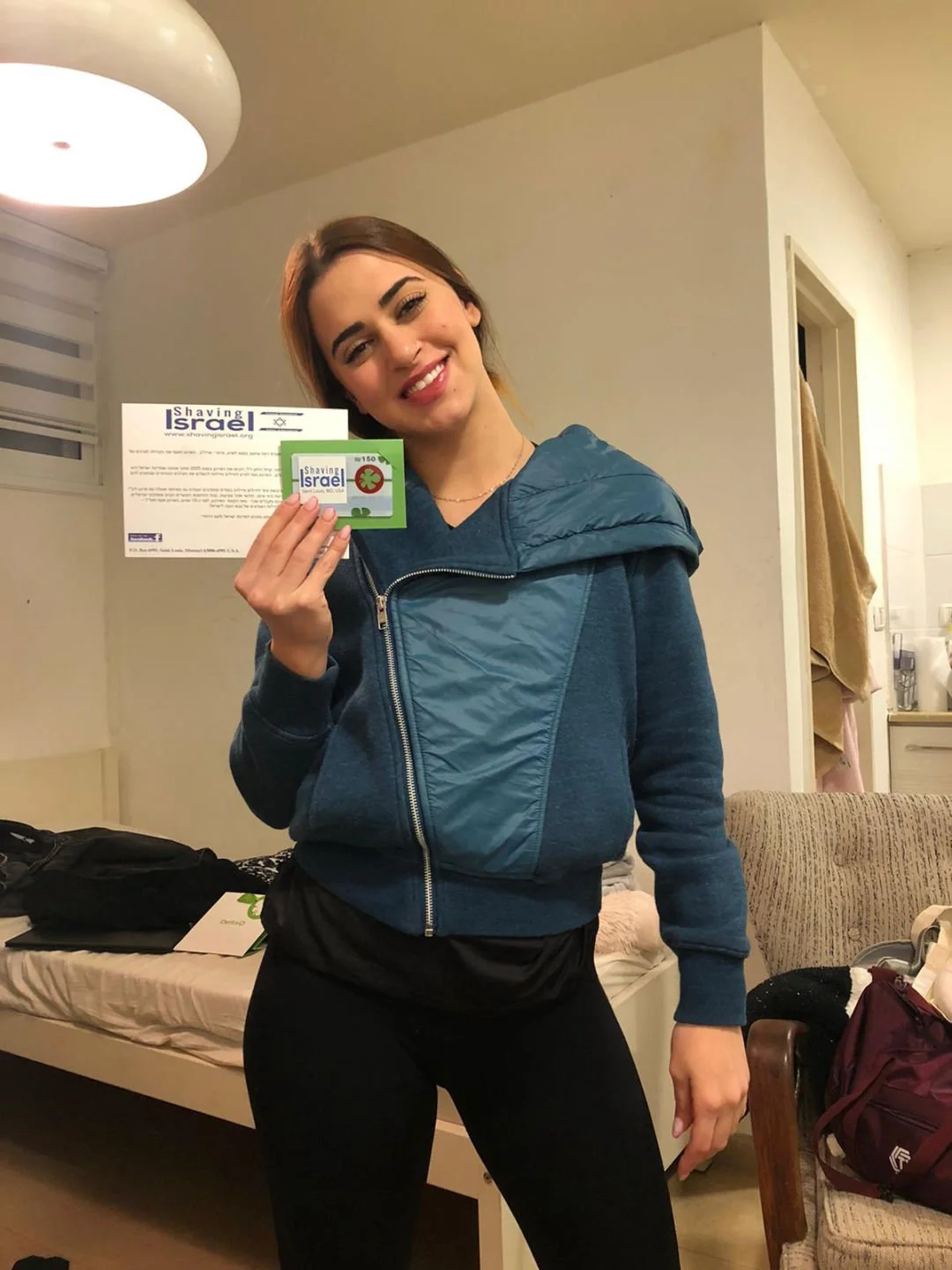 Girl smiling with Shaving Israel package.jpg
