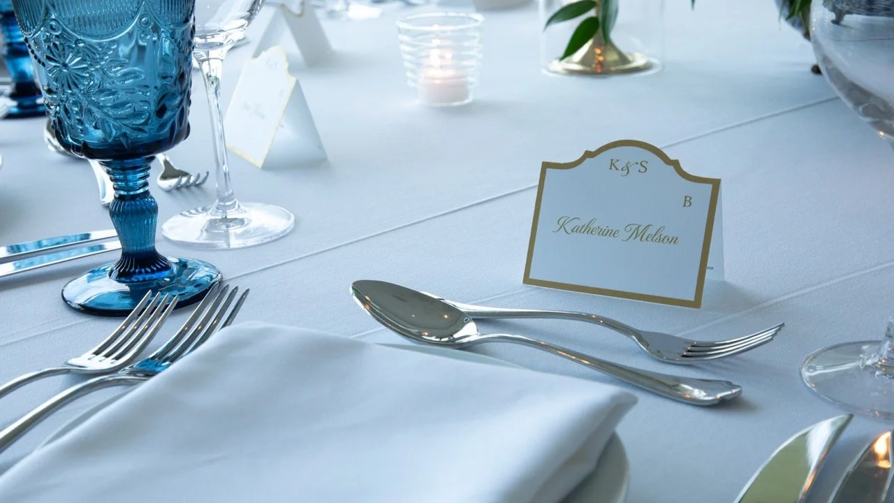Detail shot of fine dining silverware and elegant white tablescapes captured by a Charlottesville wedding photographer.