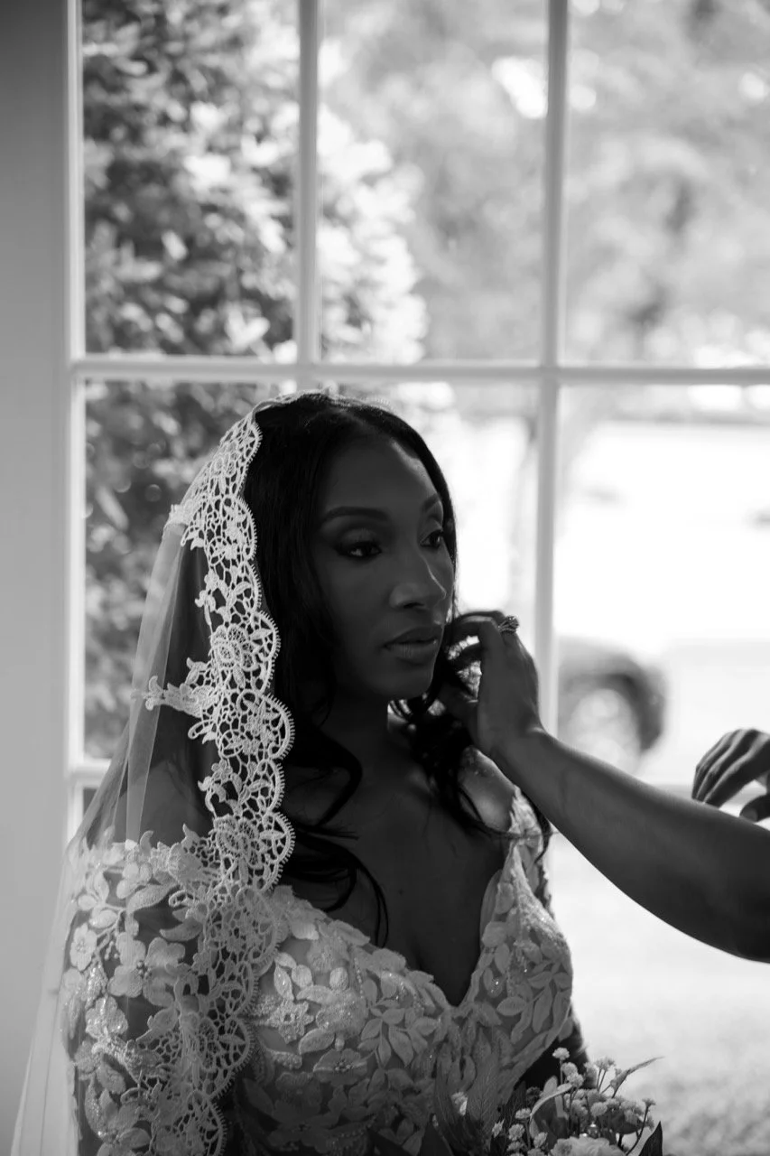 Classic black and white close-up bridal portrait of Kareese wearing a lace veil at her Portsmouth, VA wedding.