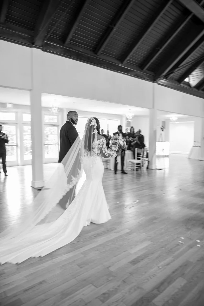 The bride and groom enter their reception ballroom at the Woman's Club of Portsmouth, a beautiful 757 wedding location.