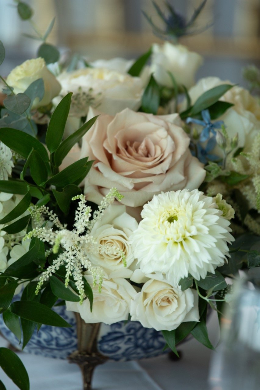 Soft blush and cream rose centerpieces accenting a classic table design for a Virginia estate dinner.