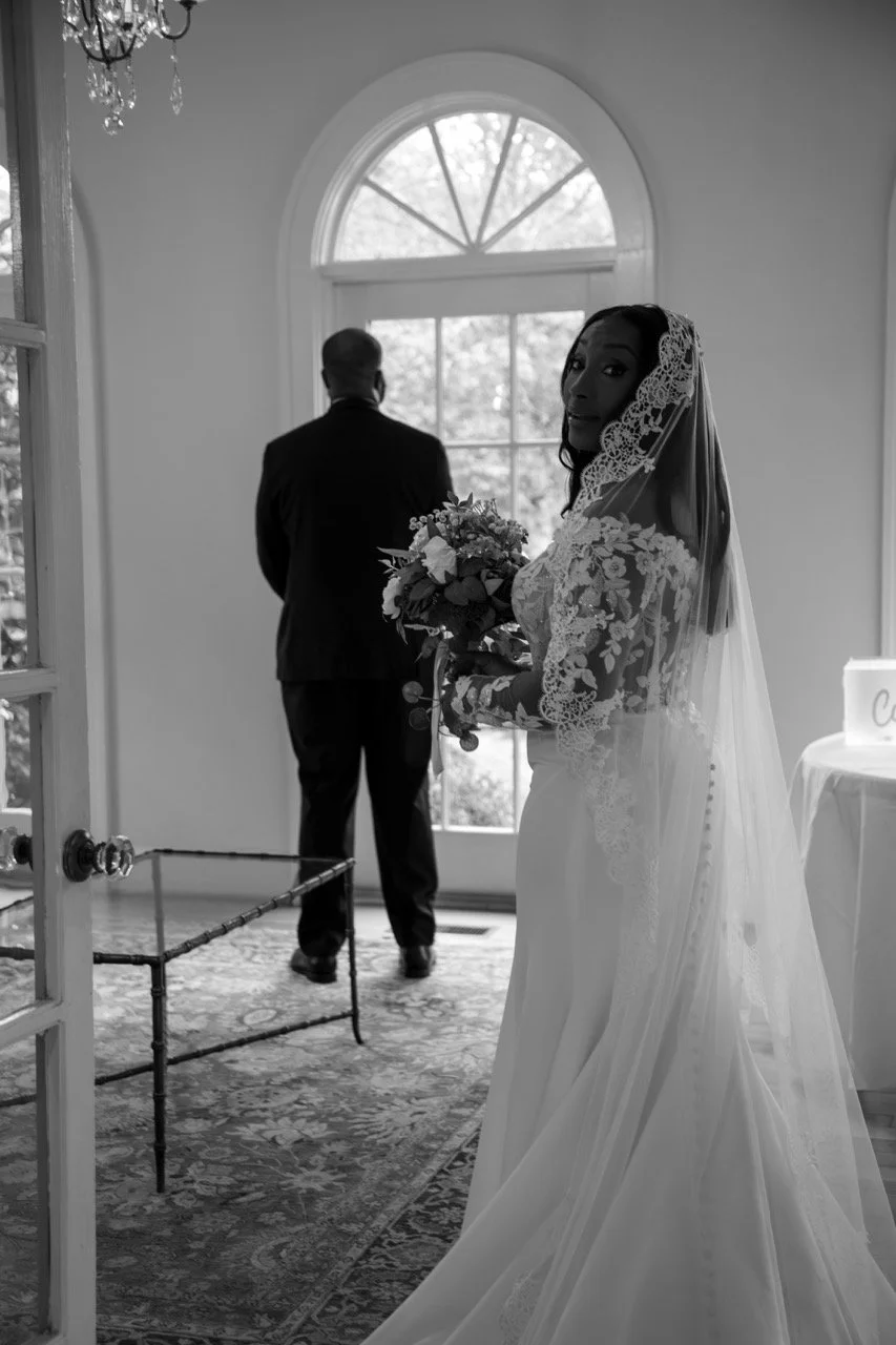 Bride Kareese approaches groom Tristan for their private first look reveal at the Woman's Club of Portsmouth.