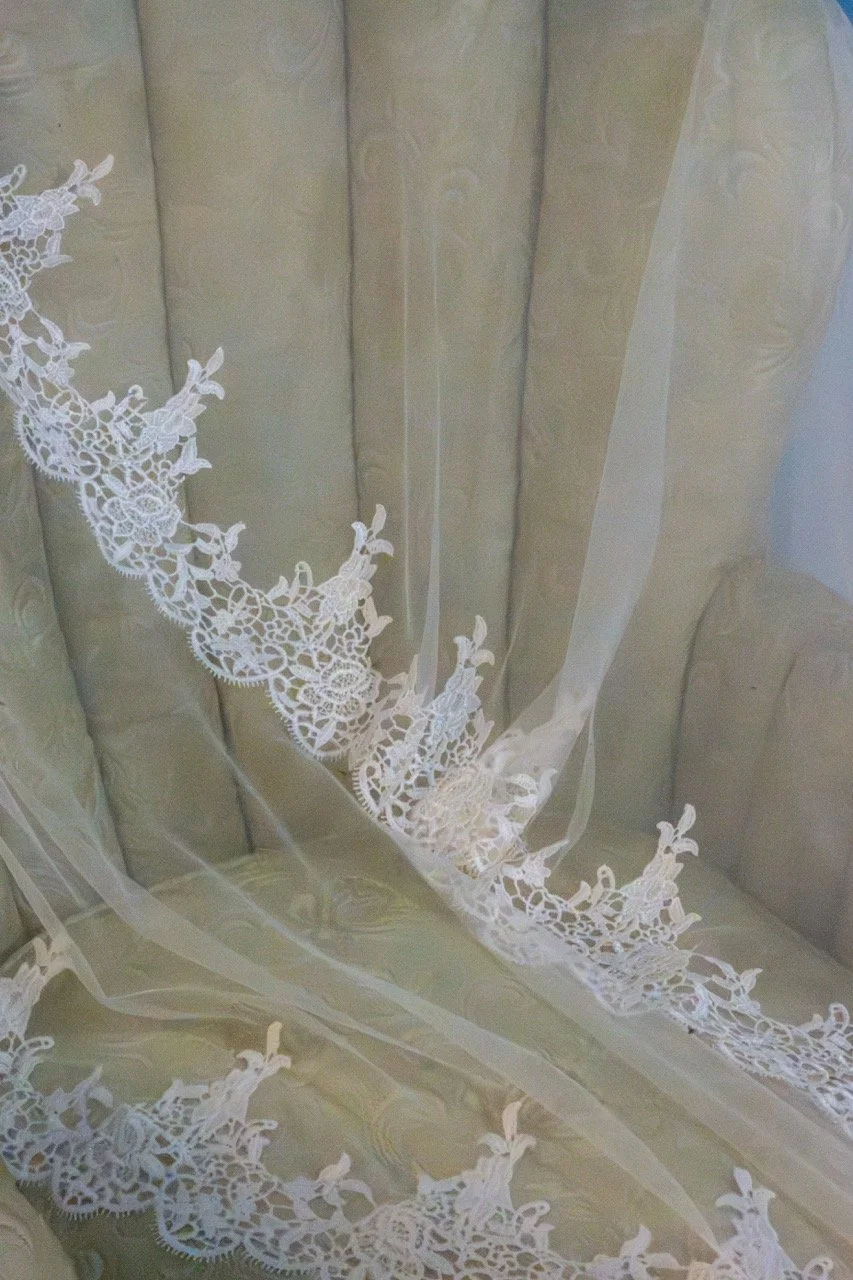Intricate lace wedding veil and bridal gown details photographed during a wedding in the 757 area.