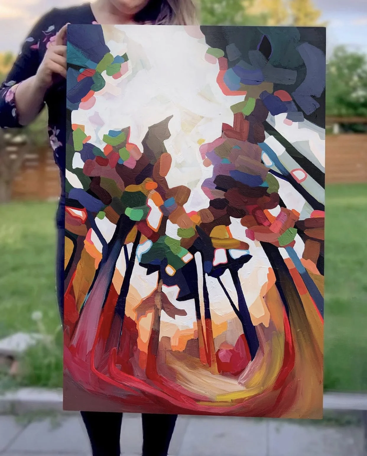 An abstract painting of trees with colorful leaves, painted with bold strokes and vivid colors.
