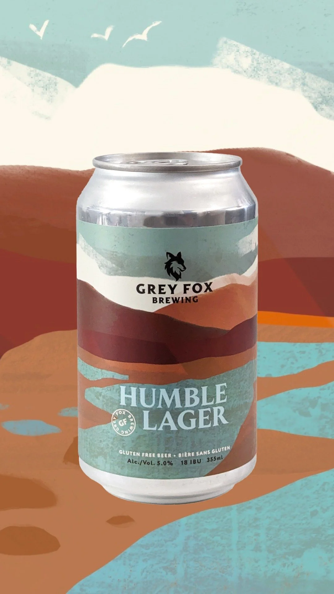 A can of Grey Fox Brewing Humble Lager gluten-free beer with an illustrated landscape background.