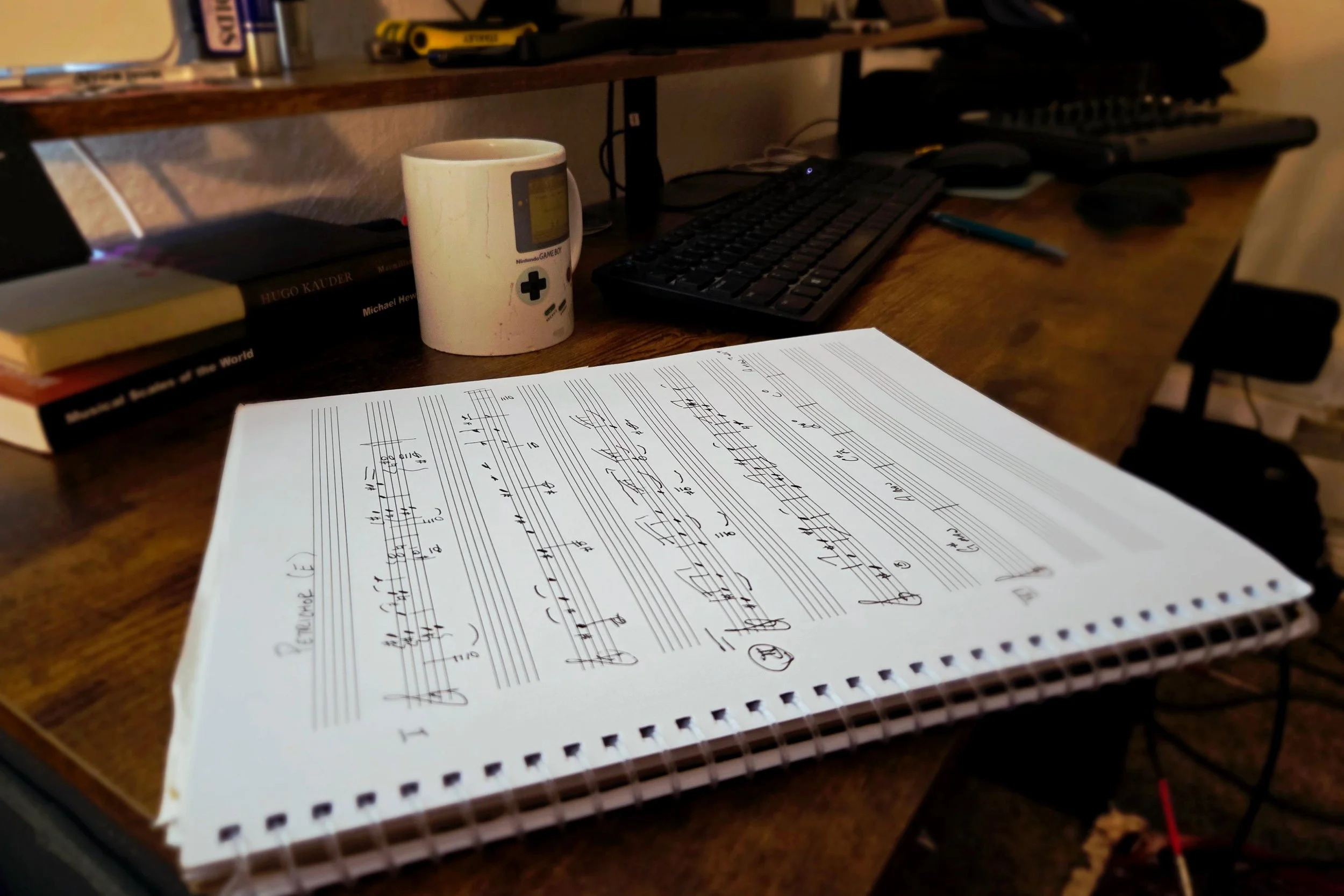 A notebook with musical notation for songs by Crecelius