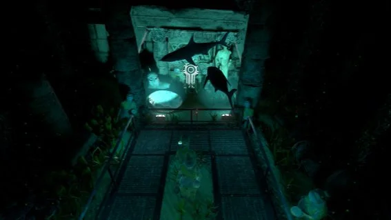 Aquarium tunnel with aquatic life and projected images of underwater scenes on the walls.