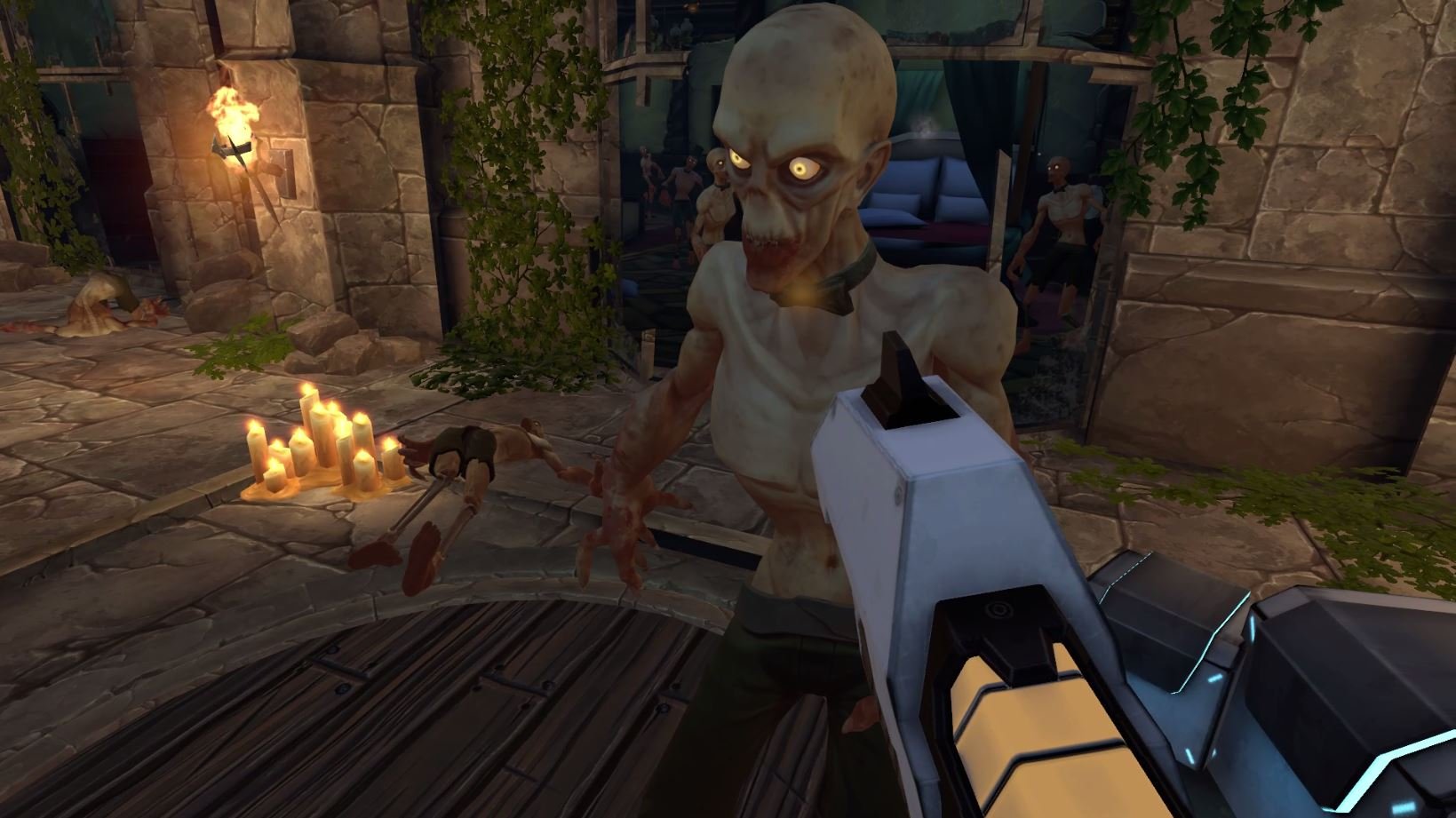 In a virtual video game scene, a first-person perspective shows a player holding a futuristic weapon aimed at an animated zombie with pale skin, skeletal features, glowing eyes, and an angry expression, inside a dimly lit stone building decorated wit