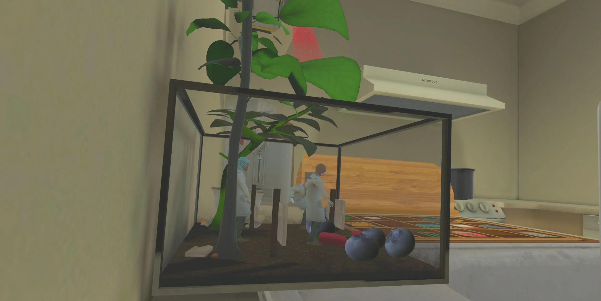 A small indoor terrarium with soil, a growing plant, and miniature figurines wearing white coats inside a framed glass box placed on a kitchen counter. The background shows a stove and a grey wall. A V.R. Escape room game