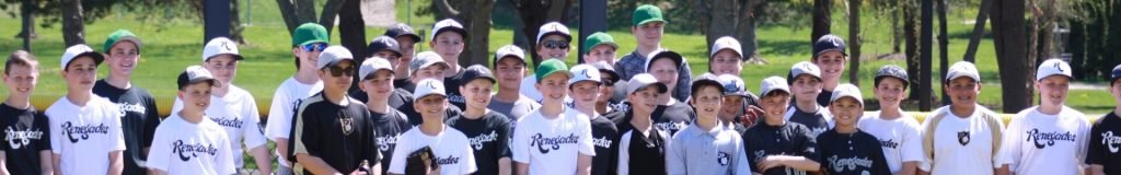 Group of young boys and girls wearing white and black T-shirts and hats, standing outdoors in a park.