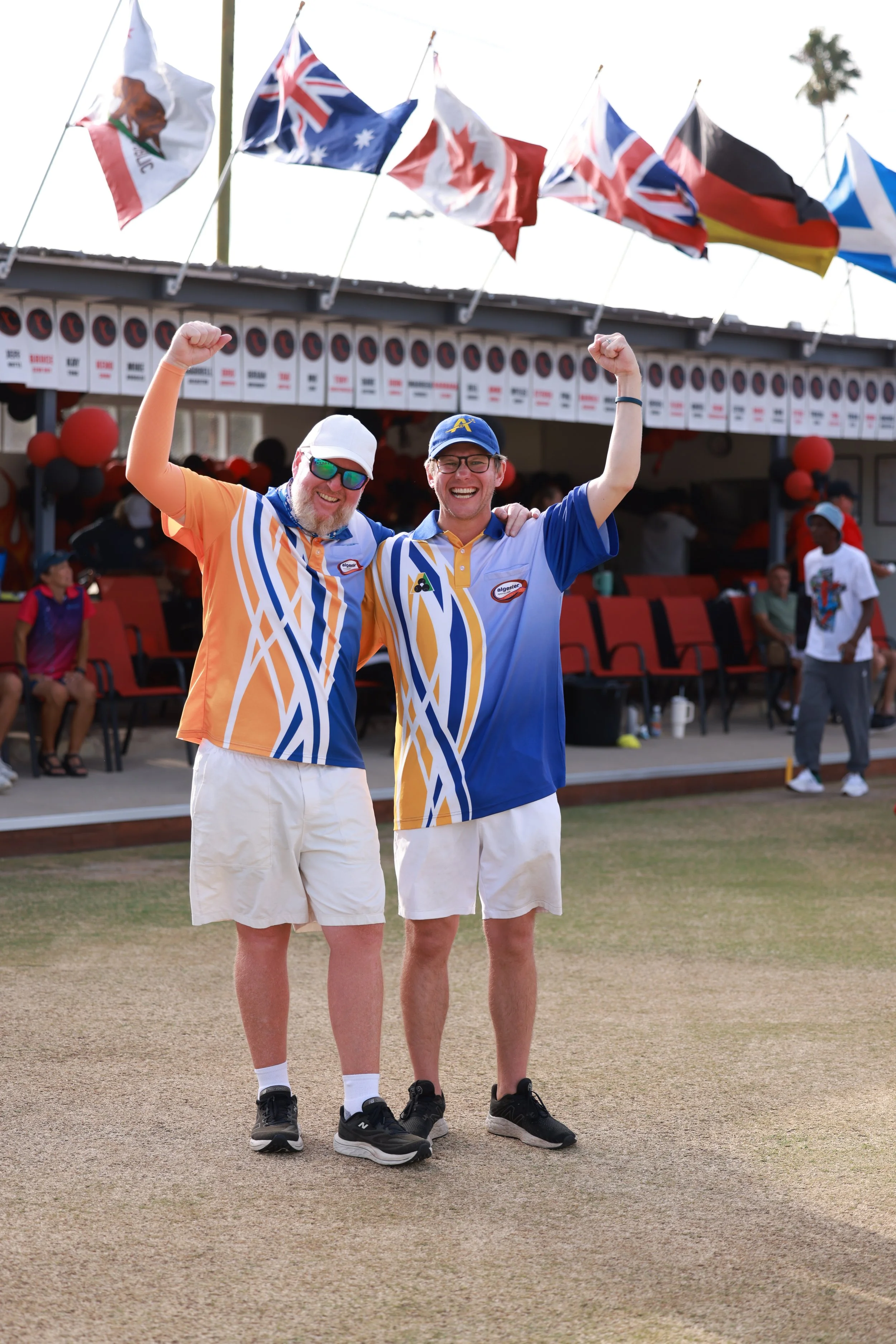 Winning pair in the 1st annual All Comers lawn bowling tournament waving to the crowd