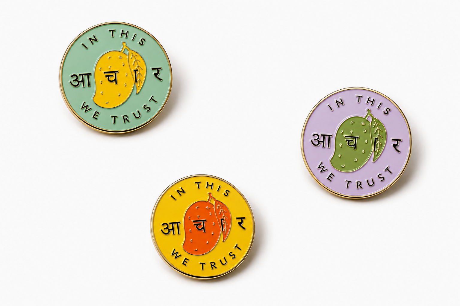 Commons Table enamel pin in green, "In this आचार we trust" design for the Green Mango & Saunf variant