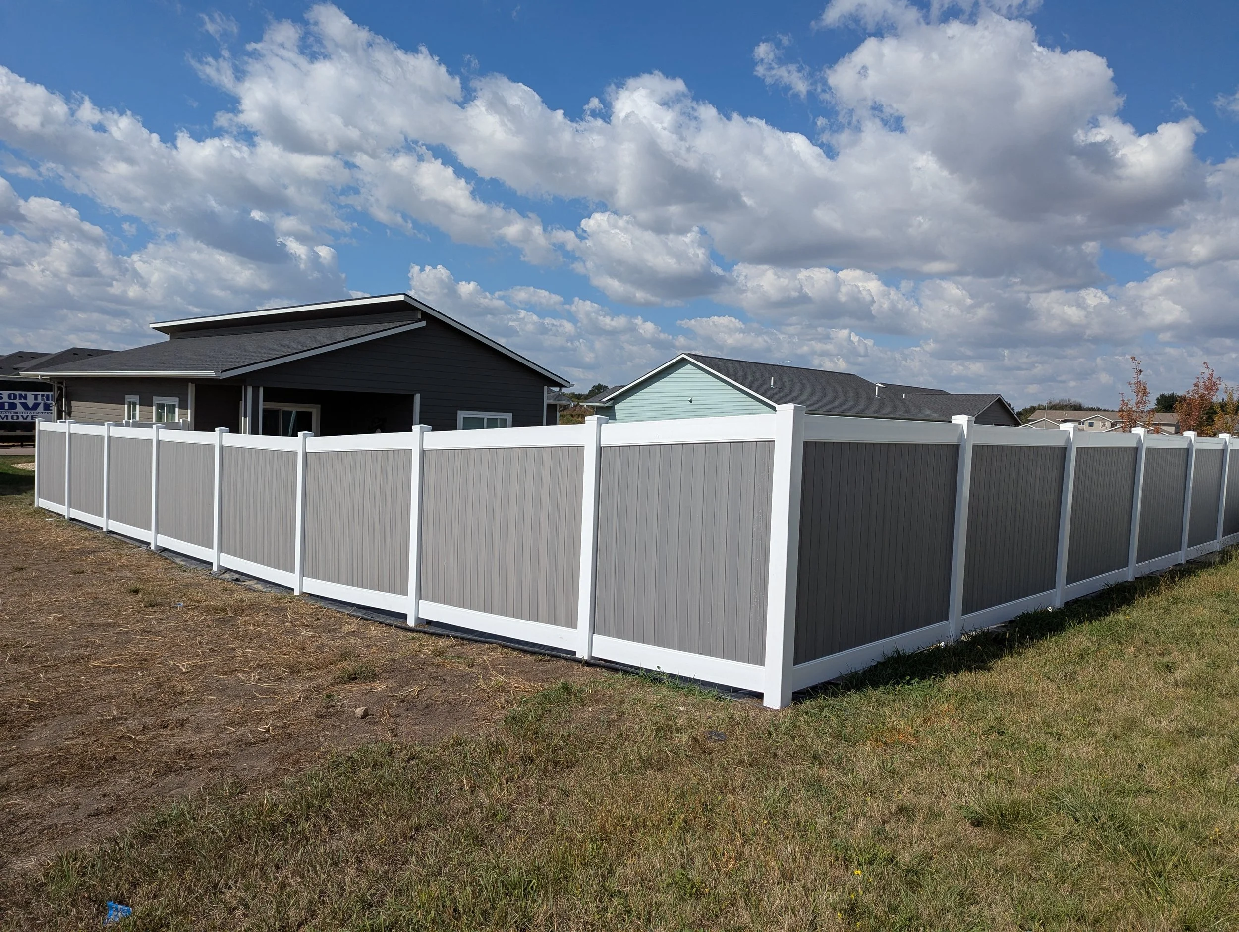 6 ft Privacy Vinyl with 2-tone colors to match house.