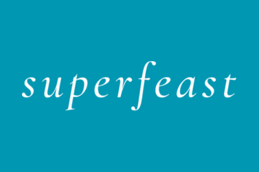 Blue background with the word 'superfeast' in white, lowercase cursive font.