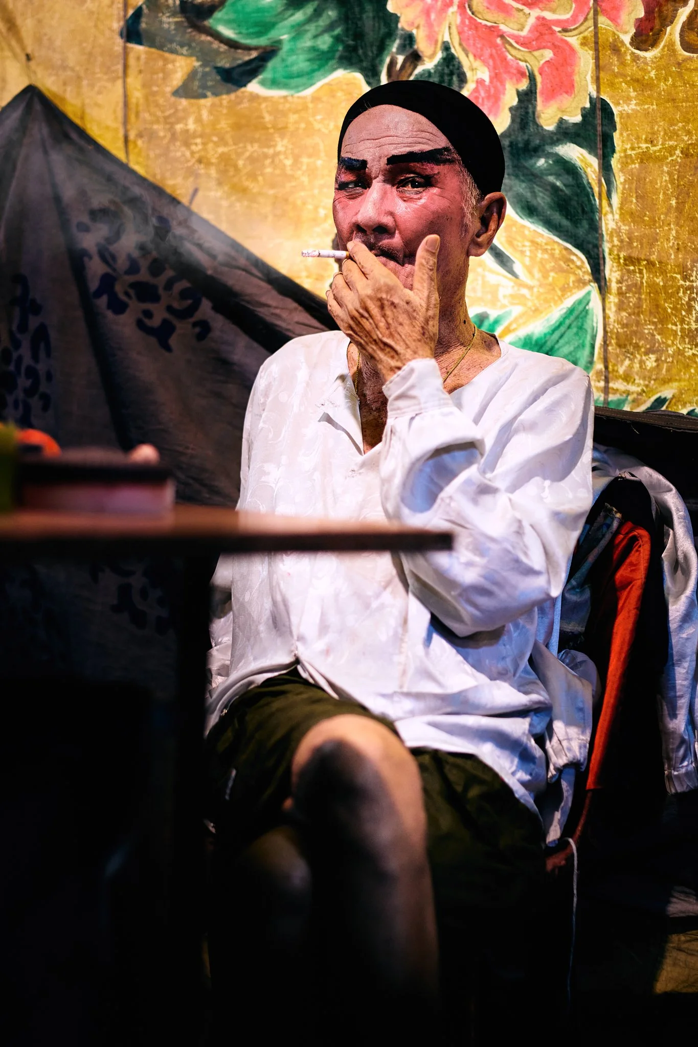 Serene Teo Photography - Portrait of a chinese opera performer seated indoors exhibited in The StreetSoup Milan exhibition