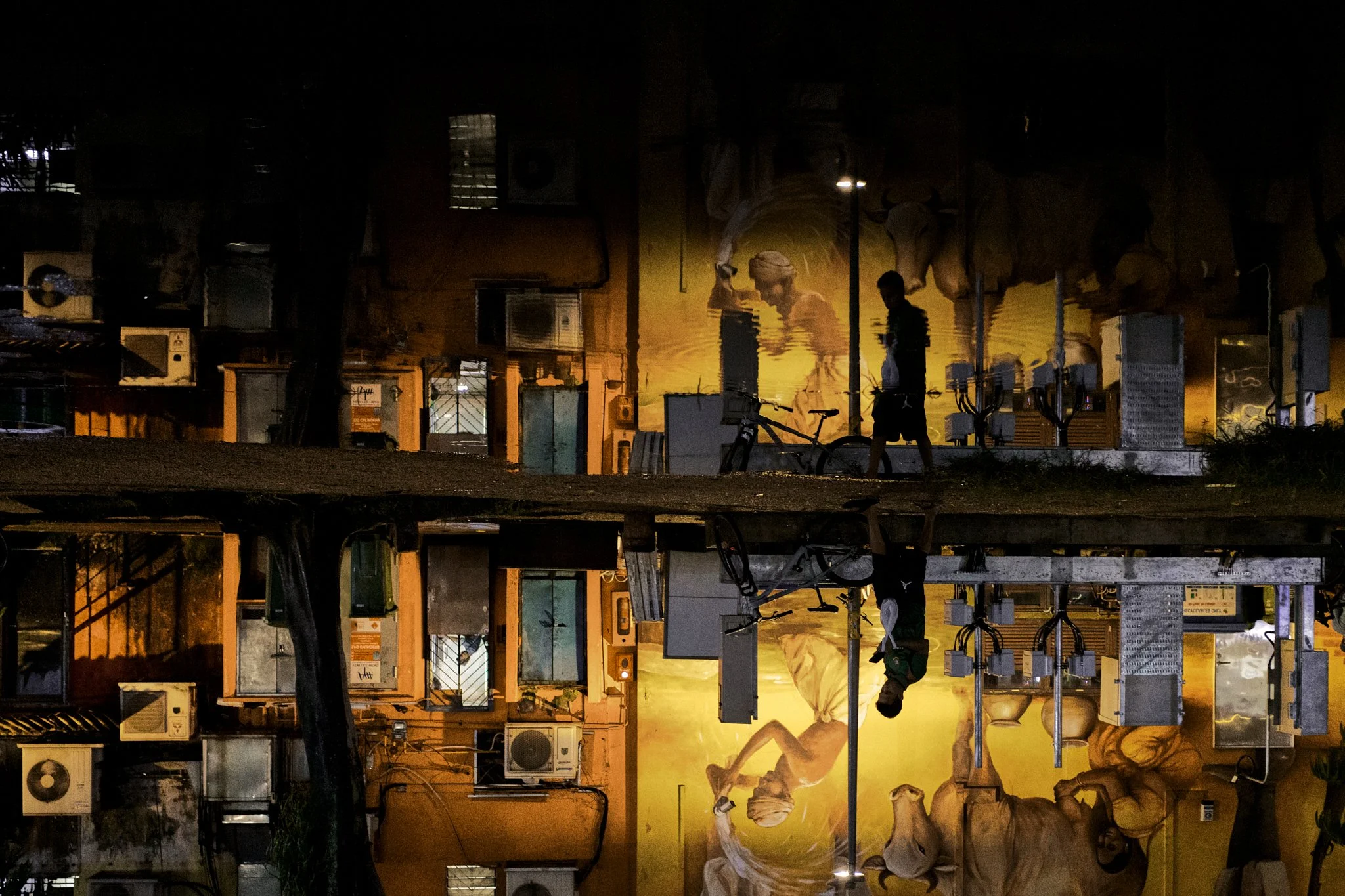 Serene Teo Photography - Street Wall mirrored by rain soaked ground featured on Photographize Street Photo Master Magazine