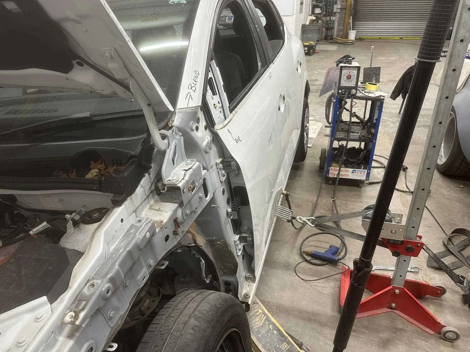 Image showing dent removal in the side of a car door