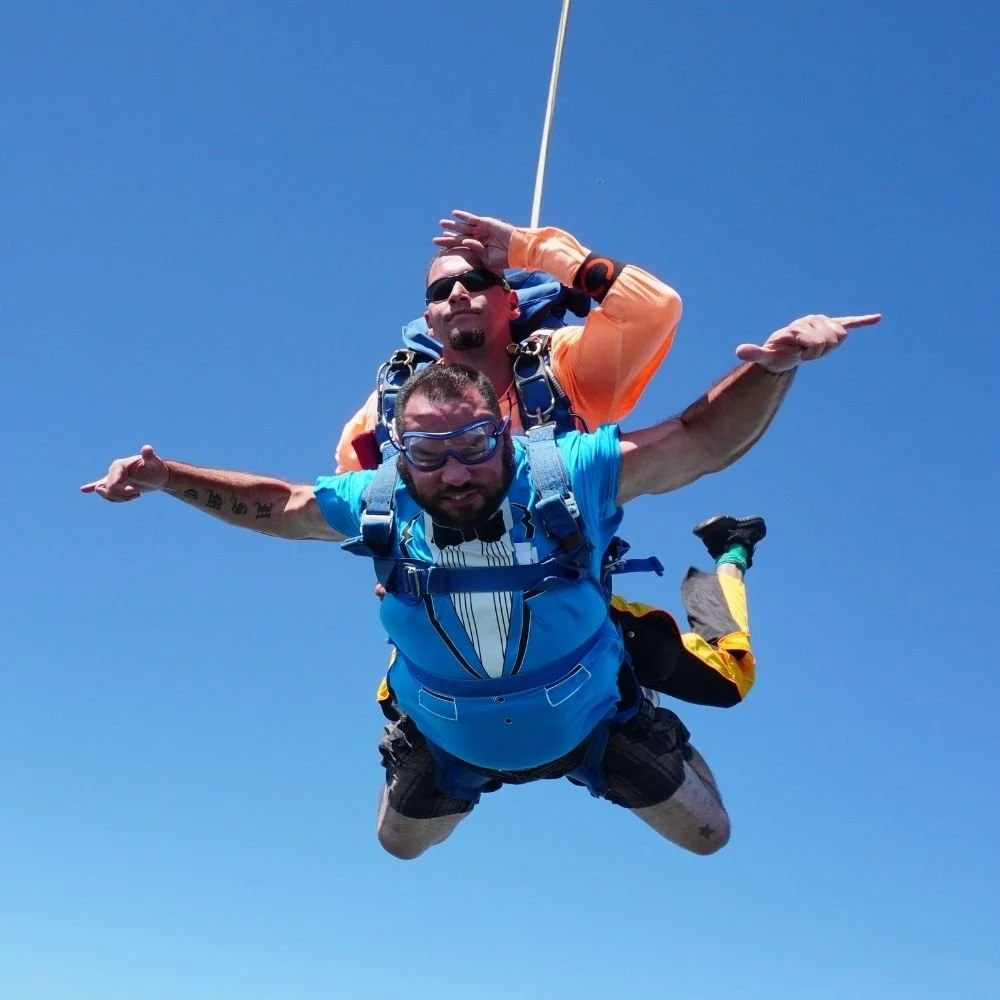 Two people while doing bungee jumping.