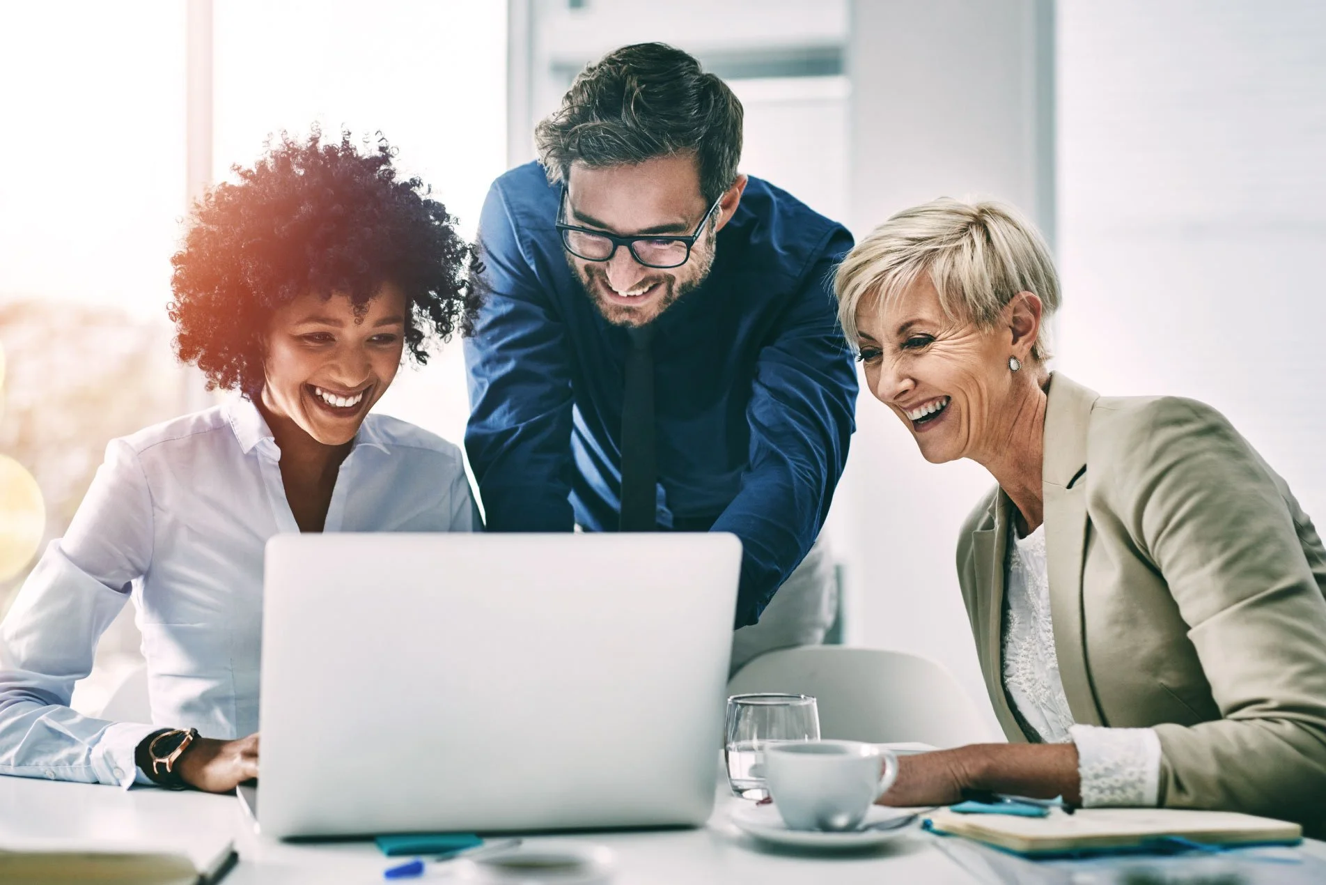 Team of programme managers collaborating and reviewing project documents