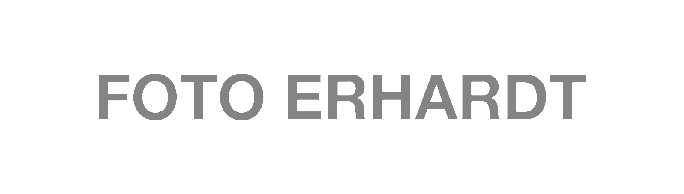 Text reading "FOTO ERHARDT" on a black background