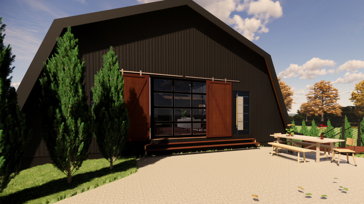 Modern house with dark exterior, large window with wooden shutters, outdoor patio with picnic table and benches, surrounded by green grass and trees with autumn foliage in the background, under a partly cloudy sky.
