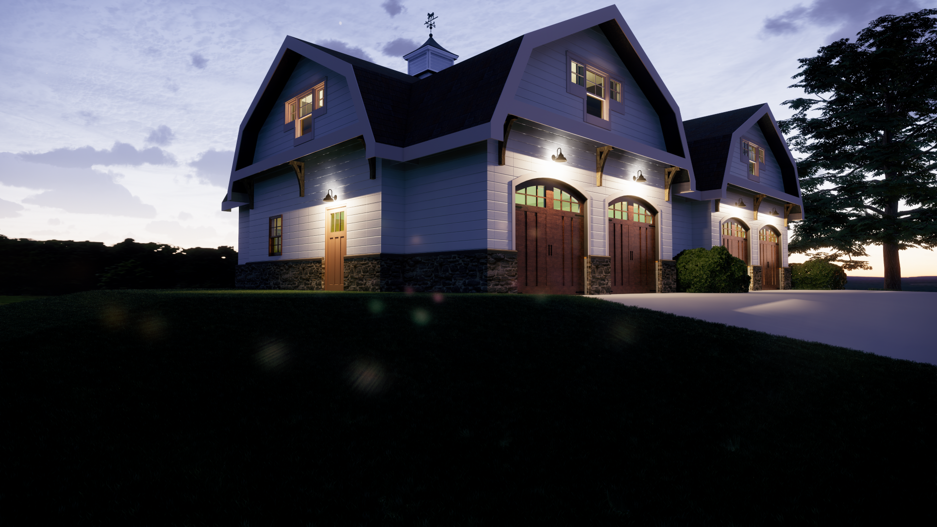 A two-story house with garage doors illuminated at dusk, white siding, stone foundation, and a large tree nearby.