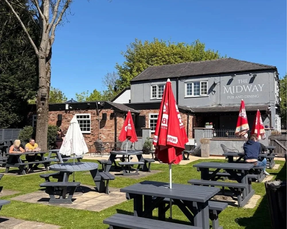 Tables in The Midway pub garden Stockport