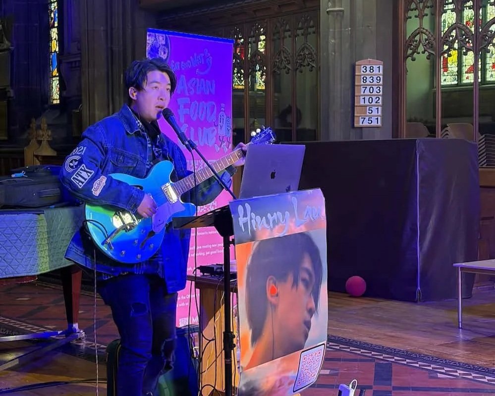Musician Hinry Lau performing at EatGoodWestUK Stockport