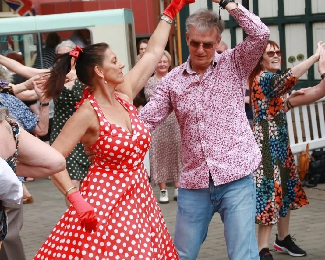 Couple dancing in 50s style dress in Stockport