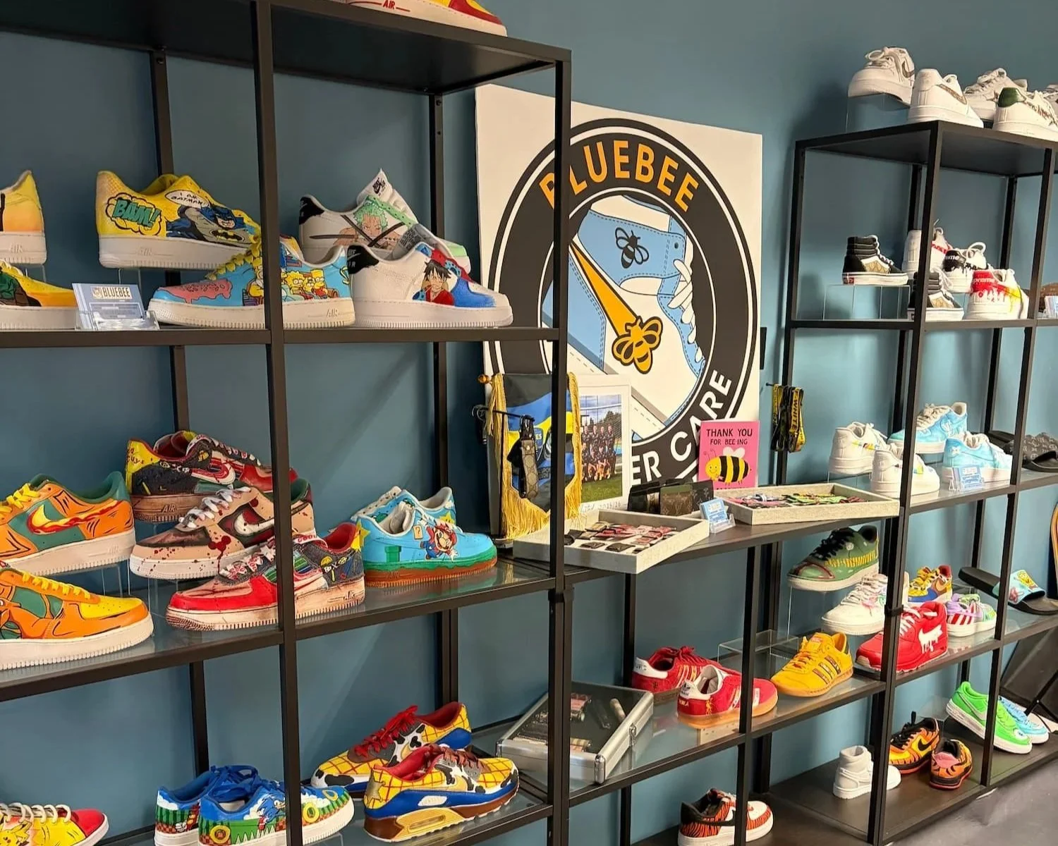 Display of customised sneakers at Blue Bee Customs in Stockport